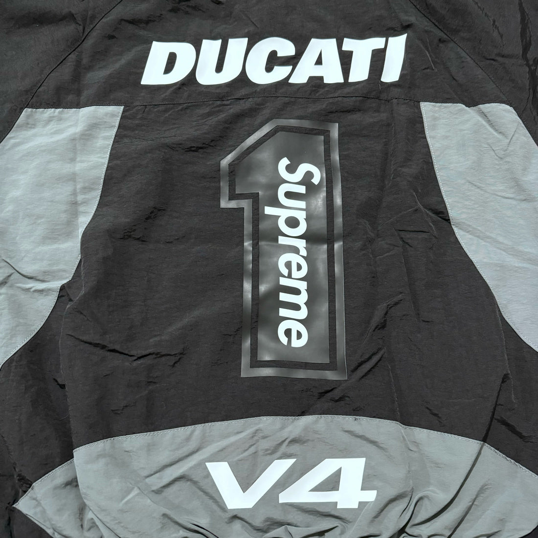 Supreme Ducati track jacket black gray and red