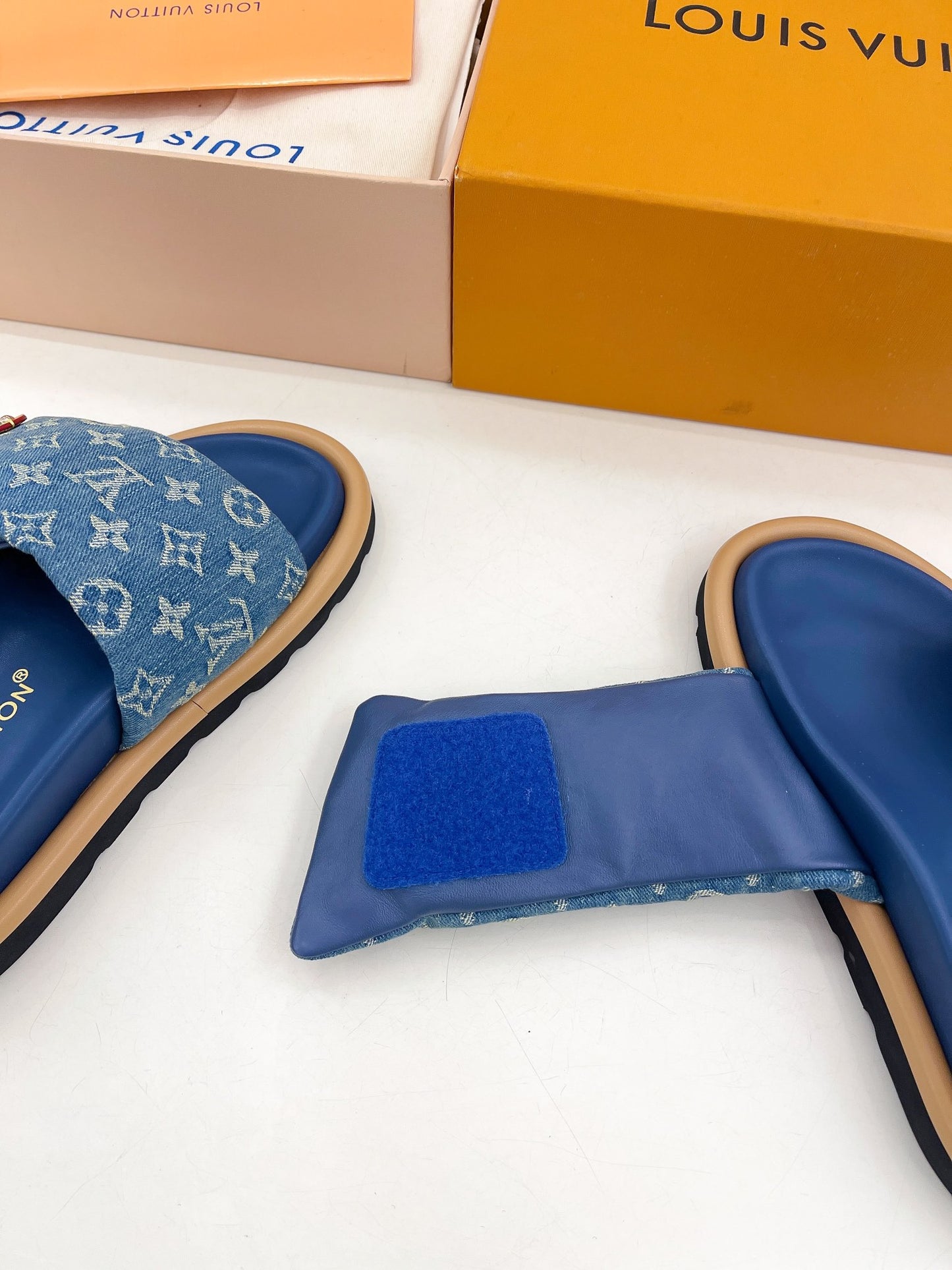Dark blue Louis Vuitton slides