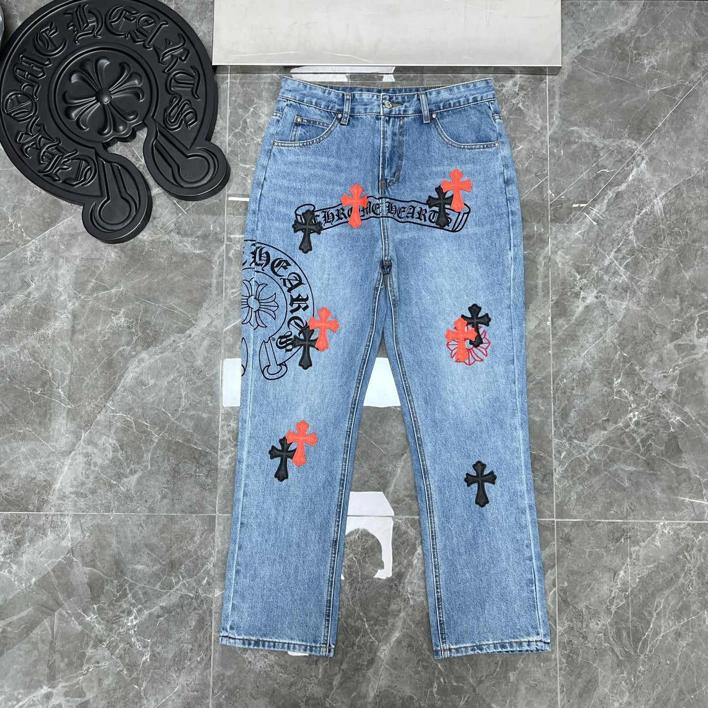 Chrome hearts jeans with black and red crosses