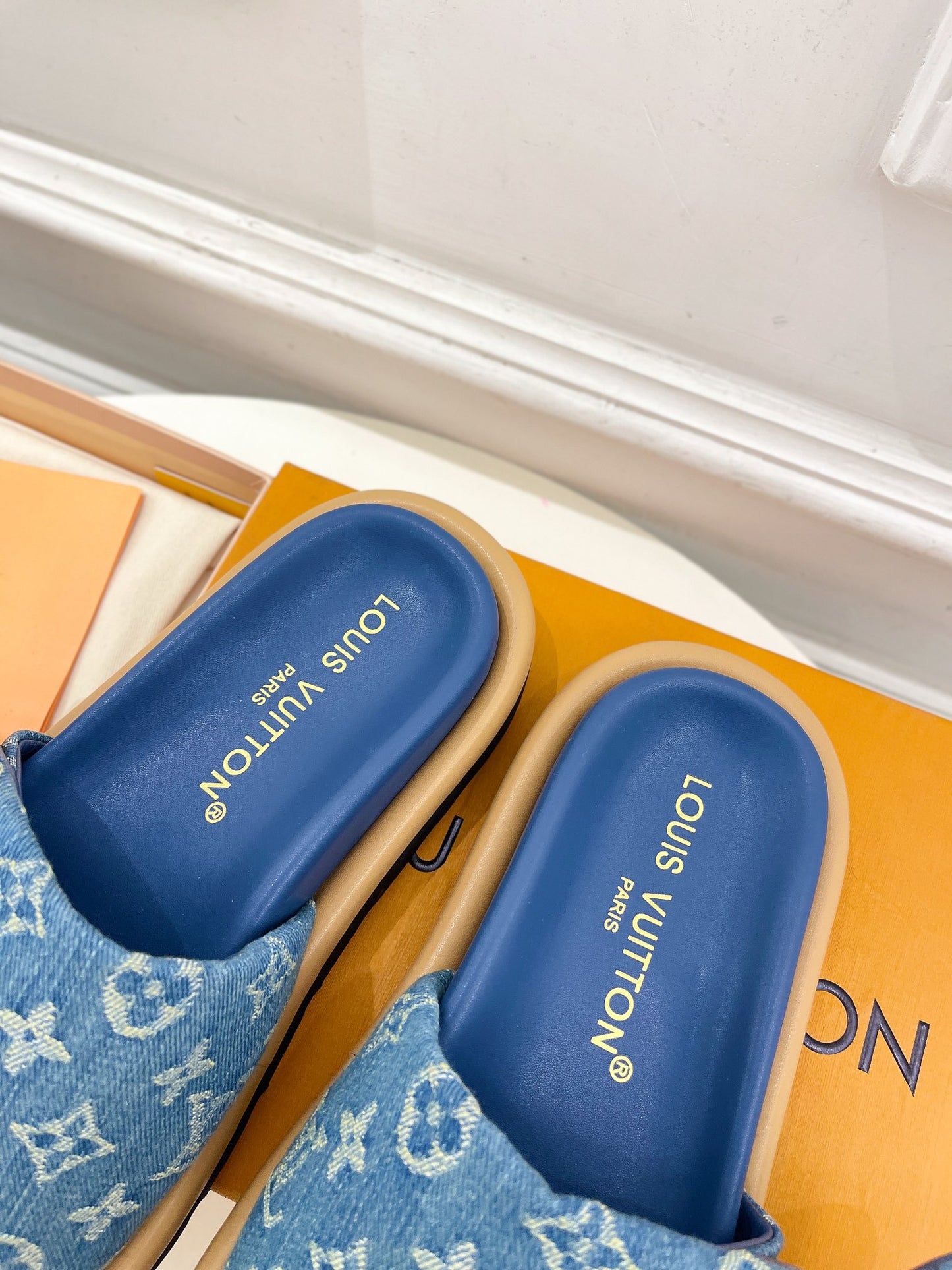 Dark blue Louis Vuitton slides