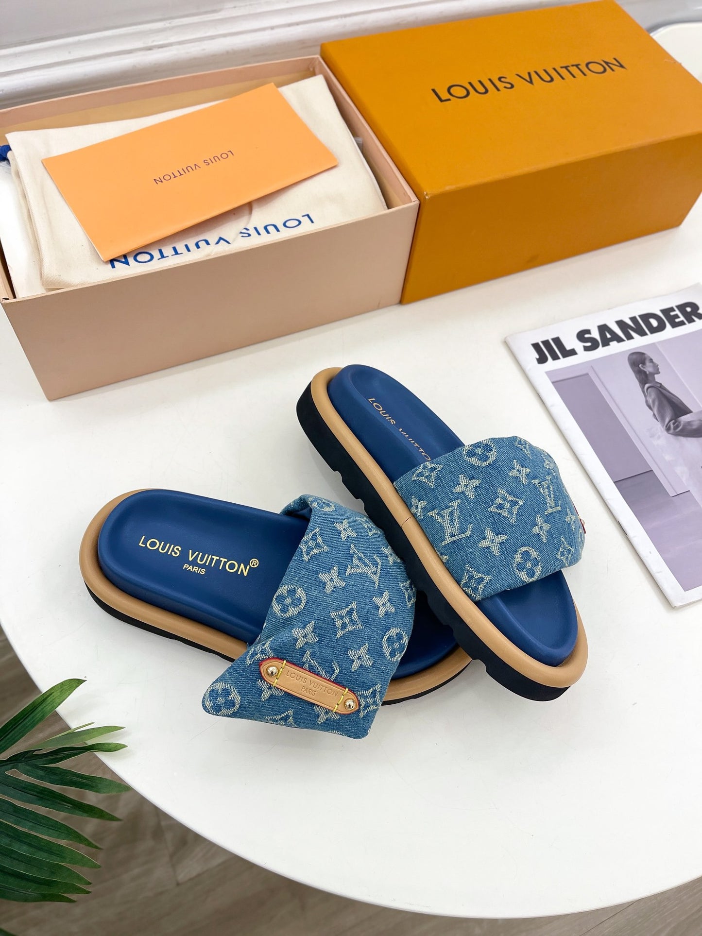 Dark blue Louis Vuitton slides