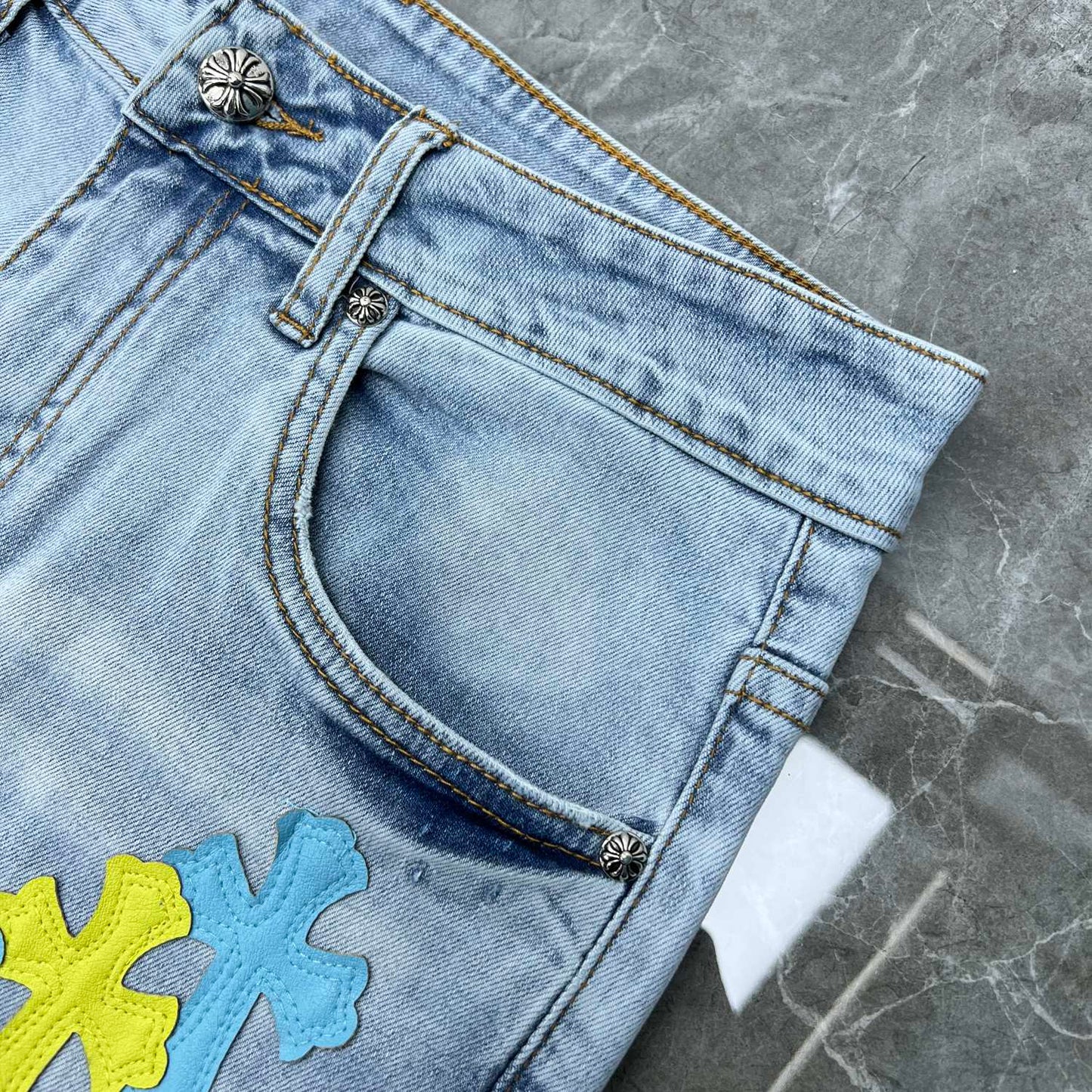 Chrome hearts jorts with blue and yellow crosses