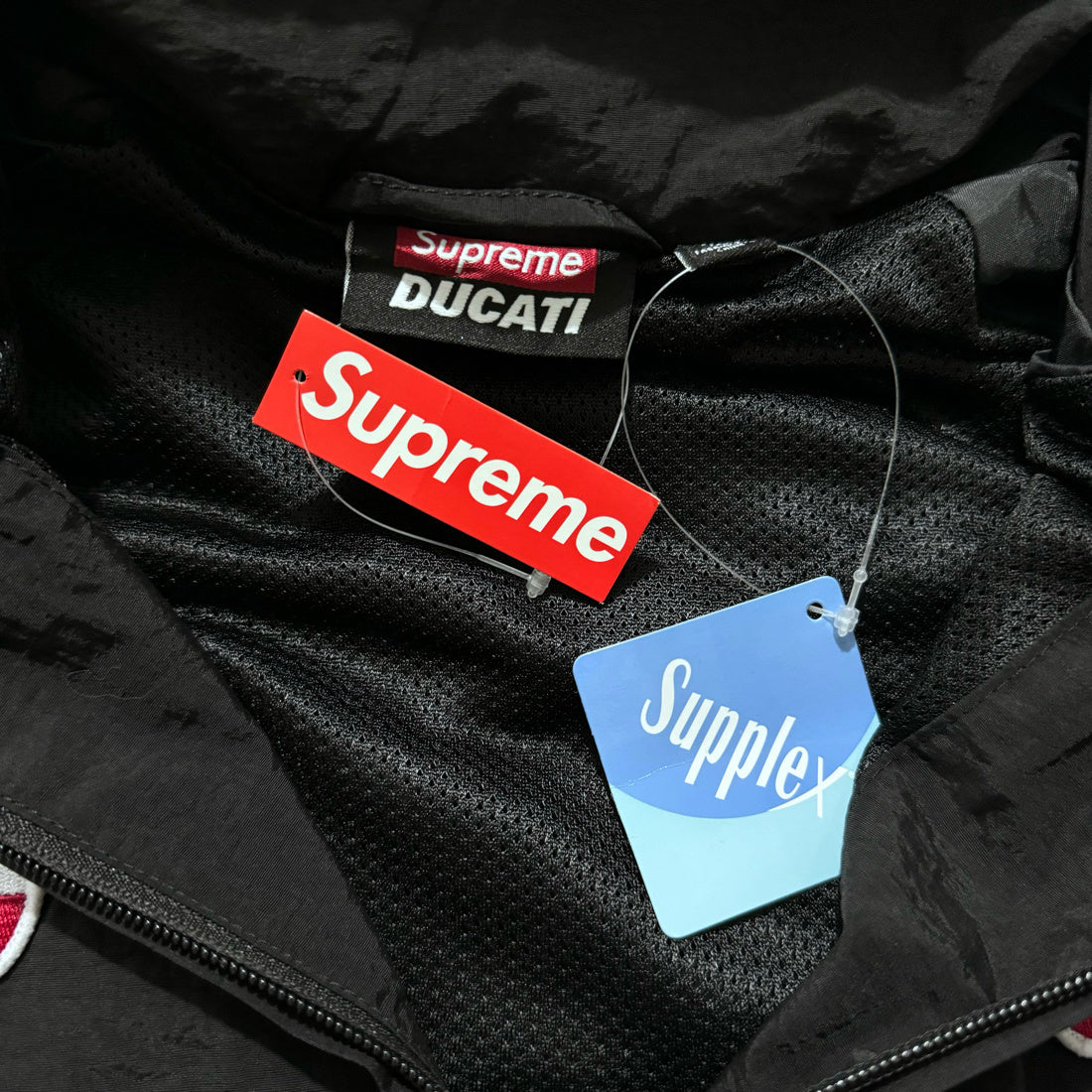 Supreme Ducati track pants black gray and red