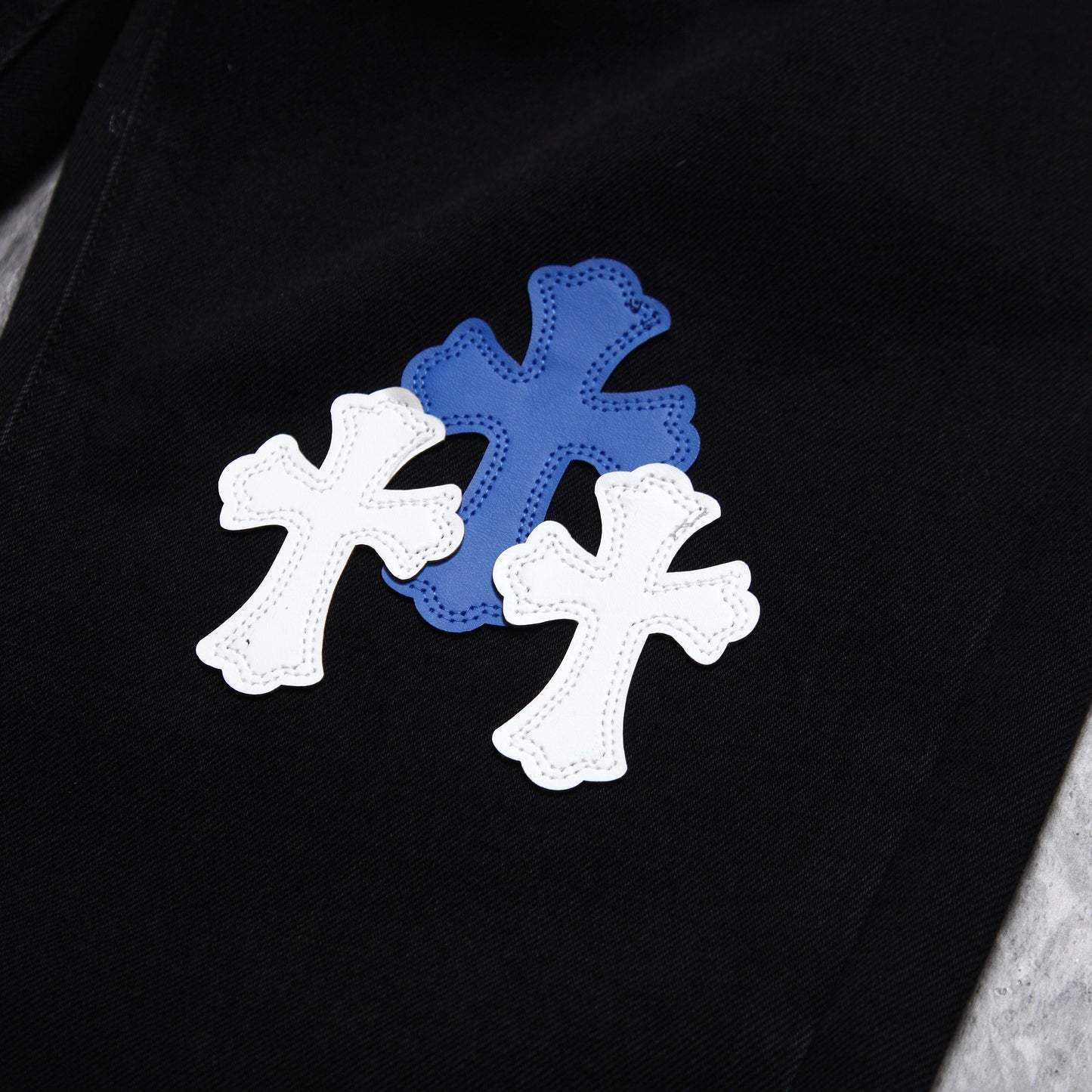 Chrome hearts jeans with colorful crosses